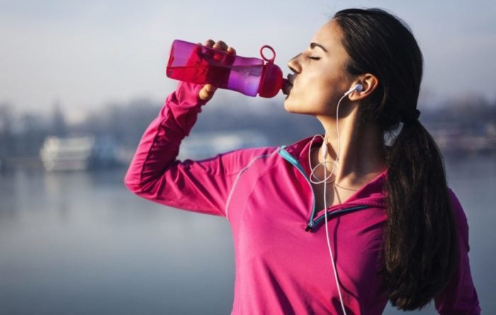 Woman drinking from a water bottle