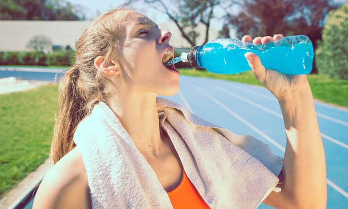 Women Drinking Electrolyte Drink to stay Hydrated